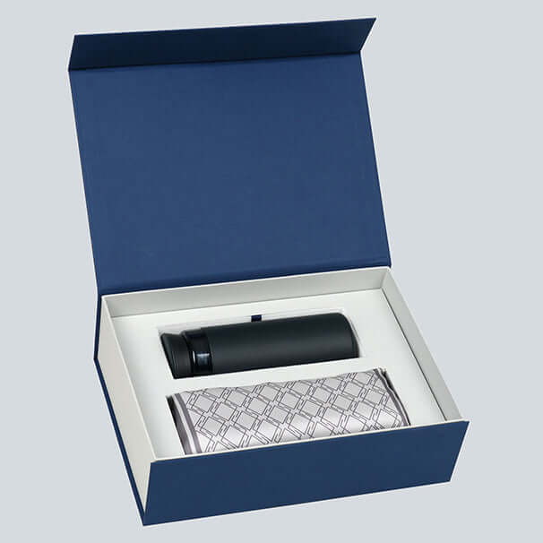 Elegant silk scarf and insulated thermos set for modern men in an open blue gift box