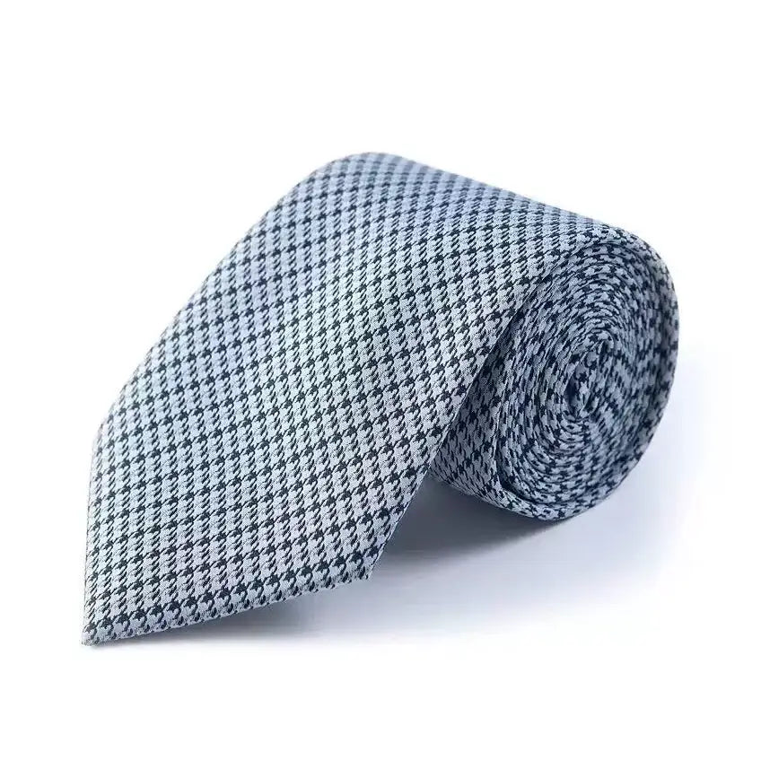 Elegant blue and white patterned silk tie, perfect accessory for the modern man's professional look.