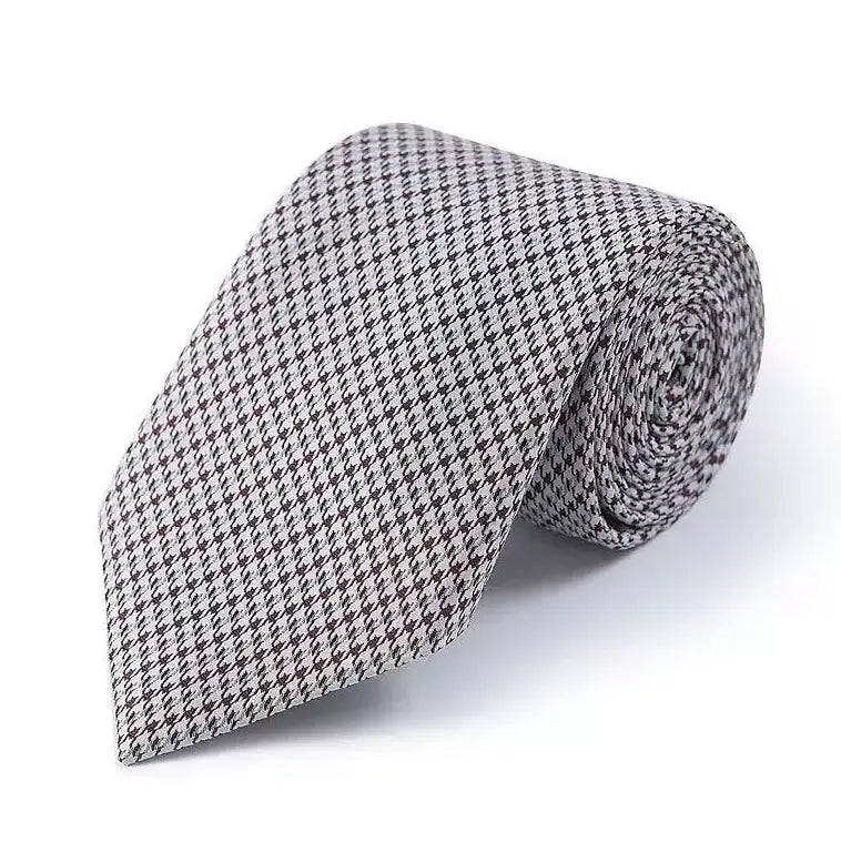 Elegant silk tie with houndstooth pattern for modern men - Exquisite accessory for business professionals.