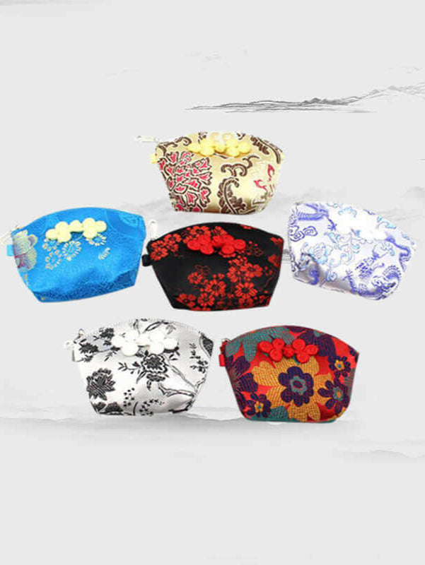 Collection of colorful Nanjing silk brocade wallets with traditional designs on a light background.