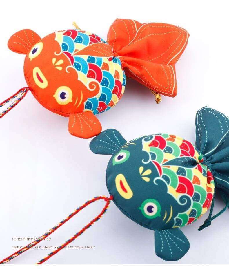 Handcrafted Koi Fish Sachets for Prosperity, featuring colorful designs and medicinal herbs.