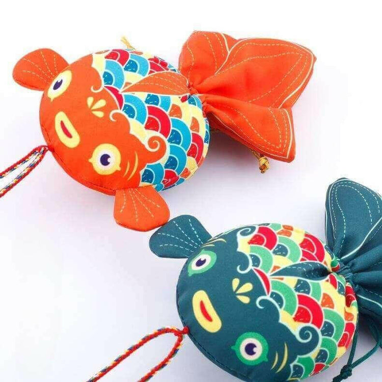 Handcrafted Koi Fish Sachets for Prosperity, featuring colorful designs and medicinal herbs.