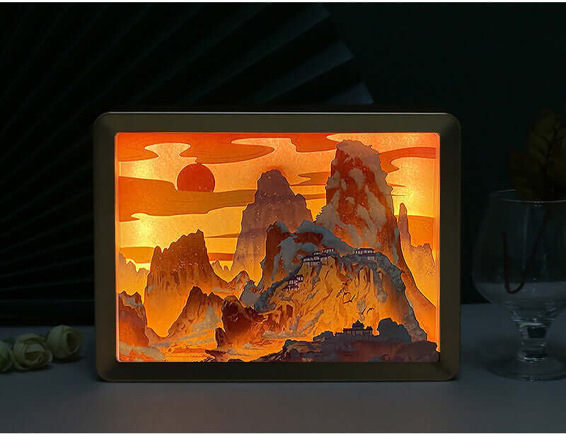 Yomkey's 3D Chinese Papercut Night Lamp illuminating intricate mountain scenery, blending traditional artistry with modern home decor lighting.