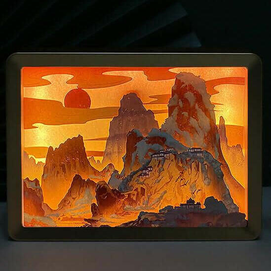 Yomkey's 3D Chinese Papercut Night Lamp illuminating intricate mountain scenery, blending traditional artistry with modern home decor lighting.