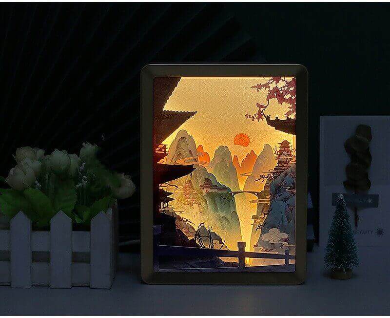 3D papercut night lamp showcasing intricate Chinese landscape design, illuminating a room with cultural elegance and modern lighting.