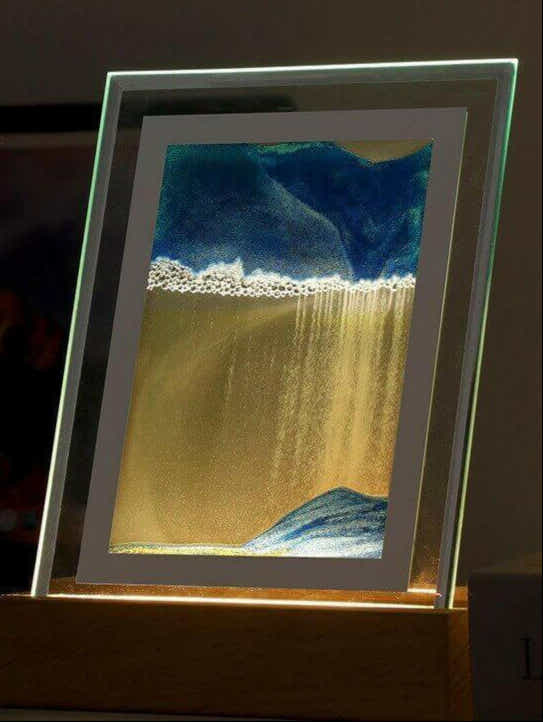 Soothing Sands 3D Night Light displaying serene shifting landscapes on a table.
