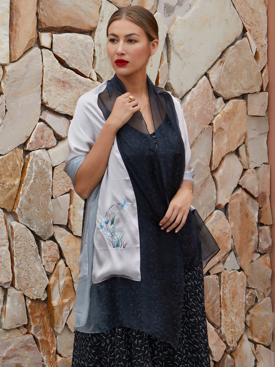 Gray-black silk scarf with orchid embroidery, showcasing a breathable, silky texture perfect for year-round wear with both elegance and comfort.