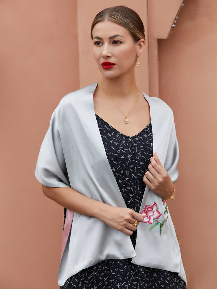 Hand-embroidered grey-pink Suzhou silk scarf featuring delicate orange blossom design, showcasing intricate craftsmanship and luxurious sheen.