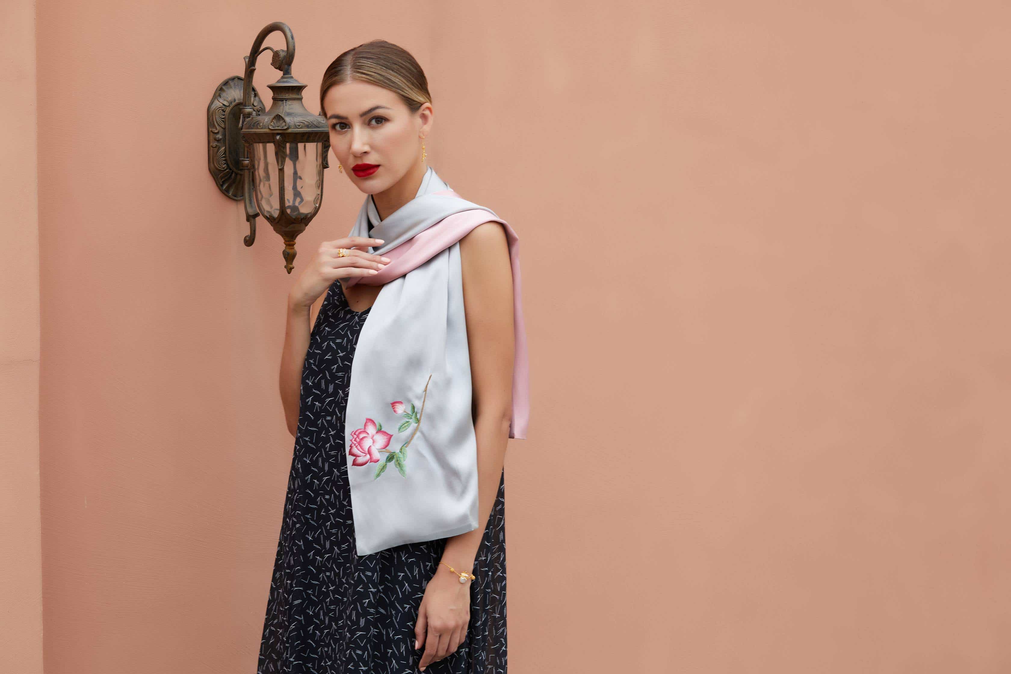 Luxurious grey-pink silk scarf with hand-embroidered orange blossoms, a perfect blend of ancient Suzhou embroidery and modern luxury.
