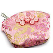 Palm-sized Nanjing brocade silk wallet in pink with traditional floral patterns and zipper closure.