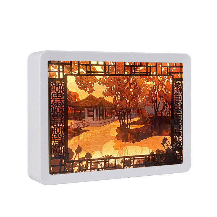 3D Chinese papercut night lamp with illuminated traditional landscape design in warm tones